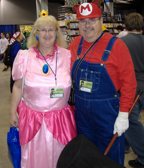 A couple dressed as Mario and the Princess